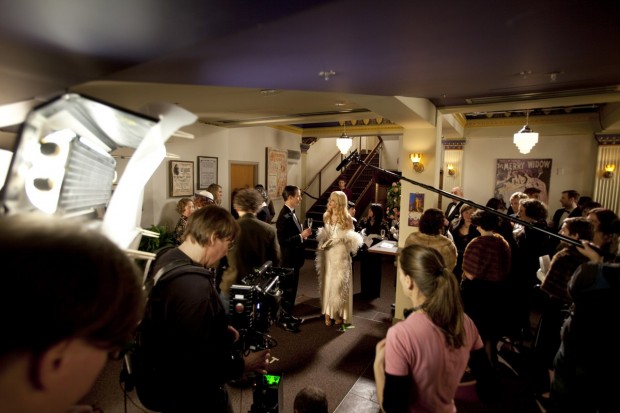 Kim Collier (foreground right) directs while a Red One camera is operated by a RoboCop-like suit wearing operator.